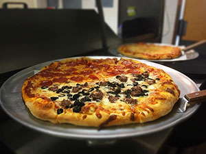 Images of different pizzas offered at Firepit.